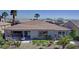 Aerial view of a landscaped backyard with desert plants and covered patio at 5059 Pensier St, Las Vegas, NV 89135