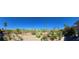 Expansive backyard featuring desert landscaping and views of the community golf course and desert landscape at 5059 Pensier St, Las Vegas, NV 89135