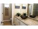 Bathroom with granite counters, vessel sink and stylish decor at 5059 Pensier St, Las Vegas, NV 89135