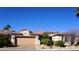 Charming single-story home features a desert landscape, a two car garage, and a well-maintained front yard at 5059 Pensier St, Las Vegas, NV 89135
