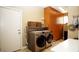 Convenient laundry room featuring stainless steel washer and dryer at 5059 Pensier St, Las Vegas, NV 89135