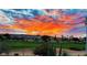 Beautiful sunset landscape view overlooking the golf course and desert landscaping creating a picturesque backdrop at 5059 Pensier St, Las Vegas, NV 89135