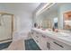 Elegant bathroom featuring double sinks, a separate shower, and a large soaking tub at 5078 Shadow River St, Las Vegas, NV 89148