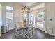 Bright dining area with table and chairs, pendant light, and sliding glass doors to the backyard at 5078 Shadow River St, Las Vegas, NV 89148