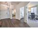 Inviting foyer showcasing light-filled rooms, hardwood floors, and a glimpse of the bathroom at 5078 Shadow River St, Las Vegas, NV 89148