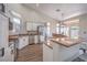 Open kitchen featuring stainless steel appliances and a large island at 5078 Shadow River St, Las Vegas, NV 89148