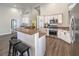 Well-equipped kitchen featuring stainless steel appliances and bar stool seating at 5078 Shadow River St, Las Vegas, NV 89148