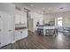 Open-concept living room with high ceilings, kitchen island with seating, and modern finishes at 5078 Shadow River St, Las Vegas, NV 89148