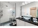 Bright bathroom featuring a glass shower, dual vanity with vessel sinks, and modern fixtures at 5081 Monte Penne Way # 2, Pahrump, NV 89061