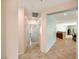 Hallway with tile floors and neutral walls leading to other rooms in the house at 5081 Monte Penne Way # 2, Pahrump, NV 89061