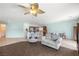 Inviting open concept living area showcasing tile flooring, a neutral color palette, and a ceiling fan at 5081 Monte Penne Way, Pahrump, NV 89061