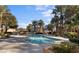 Community swimming pool features clear water, palm trees, lounge chairs, and a well-maintained deck at 5130 S Jones Blvd # 203, Las Vegas, NV 89118