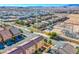 A wide aerial view of a community neighborhood showcasing the homes, streets, and desert landscape at 5186 Bootlegger Ave, Las Vegas, NV 89141