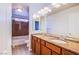 Bathroom features a double sink vanity with granite countertops and a shower-tub combination at 5186 Bootlegger Ave, Las Vegas, NV 89141