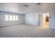 Large bonus room with generous natural light and access to bath providing a comfortable living space at 5186 Bootlegger Ave, Las Vegas, NV 89141