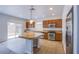 Open kitchen with granite countertops, stainless steel appliances, and a center island with pendant lighting at 5186 Bootlegger Ave, Las Vegas, NV 89141