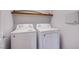 Laundry room features a washer, a dryer and a shelf on the wall at 5186 Bootlegger Ave, Las Vegas, NV 89141