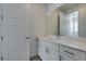 Modern bathroom featuring a white vanity with quartz countertop and a large mirror at 522 Riley Ridge Ct, Henderson, NV 89012