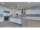 Bright kitchen featuring an island with seating, modern appliances, and stylish cabinetry at 522 Riley Ridge Ct, Henderson, NV 89012