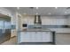 Spacious kitchen with an oversized island, stainless steel appliances, and contemporary finishes at 522 Riley Ridge Ct, Henderson, NV 89012