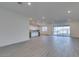 Spacious living room with tile floors, recessed lighting and access to the kitchen at 522 Riley Ridge Ct, Henderson, NV 89012