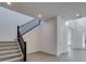 Modern staircase with black railing and carpeted steps leading to upper floor at 522 Riley Ridge Ct, Henderson, NV 89012