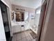 Bathroom featuring dual sinks, vanity with storage, and a separate shower stall at 5513 Oakwood Ridge St, Las Vegas, NV 89130