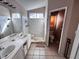 Bathroom with dual sinks, vanity with storage, and a separate shower stall at 5513 Oakwood Ridge St, Las Vegas, NV 89130