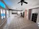 Open-concept kitchen featuring white cabinetry, stainless steel appliances, and sliding door access to the backyard at 5513 Oakwood Ridge St, Las Vegas, NV 89130