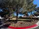 Community green space with mature trees and walking paths, perfect for outdoor activities and relaxation at 5513 Oakwood Ridge St, Las Vegas, NV 89130