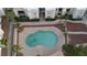 This aerial view highlights a community pool with palm trees in a well-maintained neighborhood at 6800 E Lake Mead Blvd # 1126, Las Vegas, NV 89156