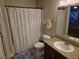 Bathroom featuring a vanity with granite countertop and shower with patterned curtain at 6800 E Lake Mead Blvd # 1126, Las Vegas, NV 89156