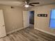 Bedroom featuring wood-look flooring, a closet and an open doorway at 6800 E Lake Mead Blvd # 1126, Las Vegas, NV 89156