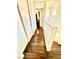 Hallway with wood floors and white doors offers access to multiple rooms at 6819 Mahogany Meadows Ave, Las Vegas, NV 89122