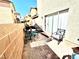 Back patio with brick flooring, outdoor seating, and a view of surrounding homes at 6819 Mahogany Meadows Ave, Las Vegas, NV 89122