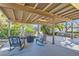 Back patio with seating area, rocking chairs, and outdoor furniture next to the jacuzzi at 6925 Donald Nelson Ave, Las Vegas, NV 89131