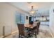 Bright dining room with rug and wood table set in a modern well-lit home at 6925 Donald Nelson Ave, Las Vegas, NV 89131