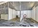 View of an interior horse stall complete with white paneling and a corrugated steel ceiling at 6925 Donald Nelson Ave, Las Vegas, NV 89131