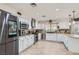 Well-equipped kitchen featuring granite countertops, stainless steel appliances, and white cabinetry at 6925 Donald Nelson Ave, Las Vegas, NV 89131