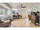 Light and bright living room with tile floors, neutral walls, and a ceiling fan at 6925 Donald Nelson Ave, Las Vegas, NV 89131