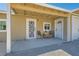 Covered patio with seating area and decorative door at 6925 Donald Nelson Ave, Las Vegas, NV 89131