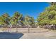 A round pen with sand footing and a metal rail fence is surrounded by trees at 6925 Donald Nelson Ave, Las Vegas, NV 89131