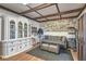 Tack room with white cabinet and seating area with wood beam ceilings at 6925 Donald Nelson Ave, Las Vegas, NV 89131