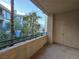 Balcony featuring exterior storage, privacy, and peaceful view of the complex landscaping at 7123 S Durango Dr # 206, Las Vegas, NV 89113