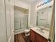 Bathroom with wood-look flooring, shower-tub combo, and vanity at 7123 S Durango Dr # 206, Las Vegas, NV 89113