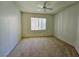 Spacious carpeted bedroom featuring ceiling fan and window for natural light at 7123 S Durango Dr # 206, Las Vegas, NV 89113