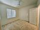 Bedroom featuring a ceiling fan, a window with blinds, and carpeted flooring at 7123 S Durango Dr # 206, Las Vegas, NV 89113