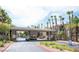 Welcoming gated community entrance featuring palm trees and well-maintained landscaping at 7123 S Durango Dr # 206, Las Vegas, NV 89113