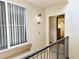 Exterior of condo with railing, showing view into living area at 7123 S Durango Dr # 206, Las Vegas, NV 89113