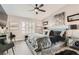 This luxurious bedroom features a faux fur throw blanket, modern light fixtures, and beautiful contemporary art at 7250 Diamond Canyon Ln # 204, Las Vegas, NV 89149